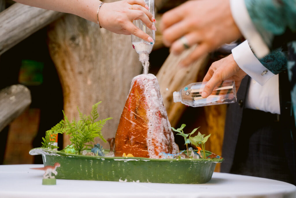 Liquid being poured onto a small volcano 