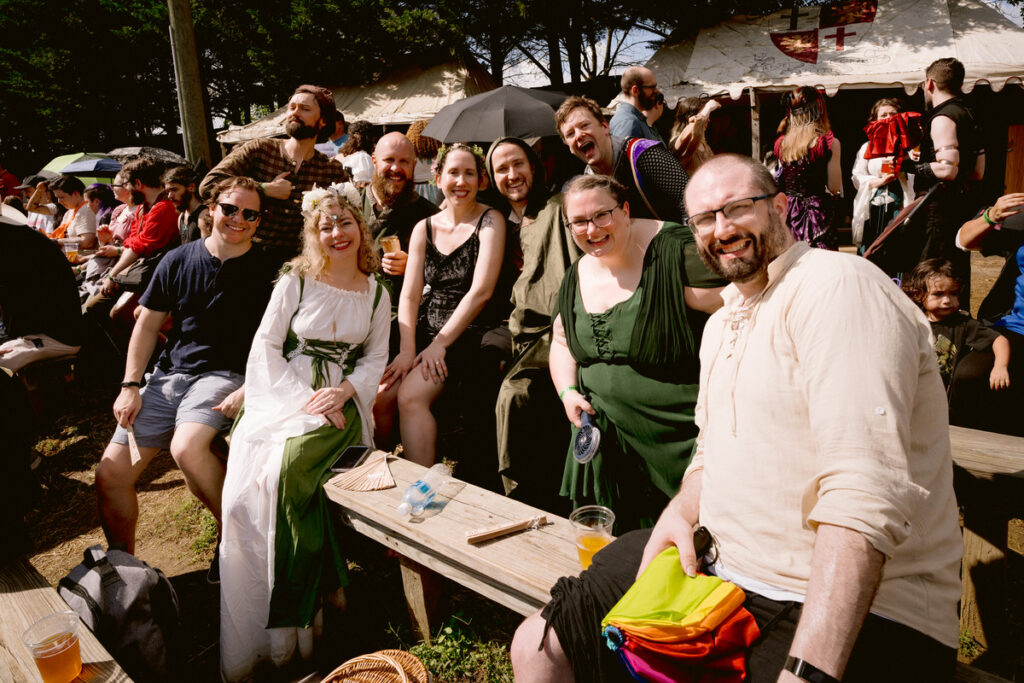 A group of wedding guests dressed up at a renaissance festival wedding 