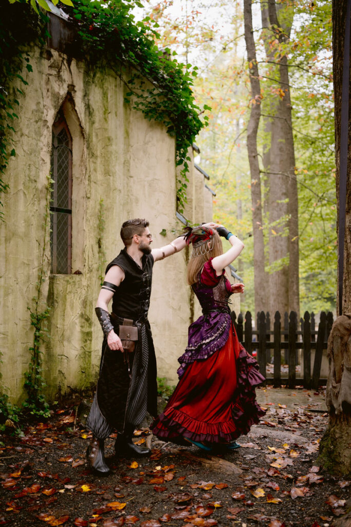 A couple dancing in a small alley on their wedding day 